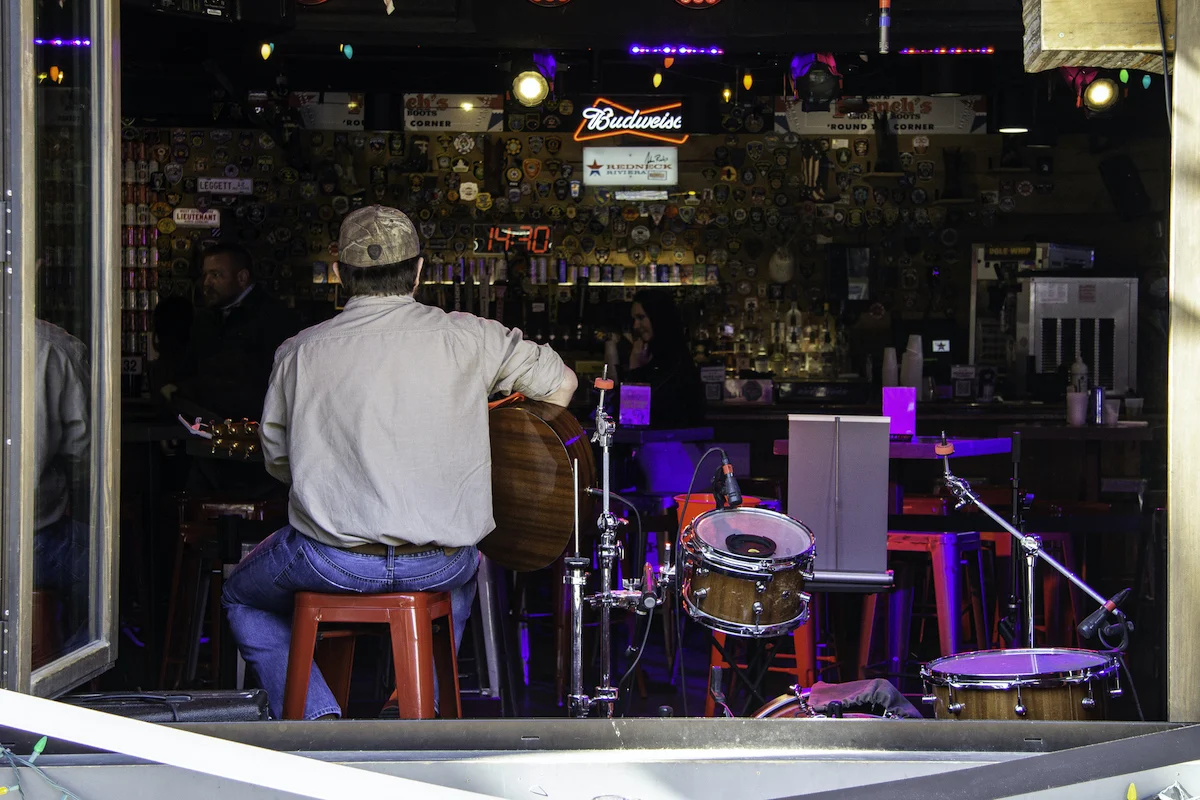 A musician pays songs at a local bar in Jackson, TN. 